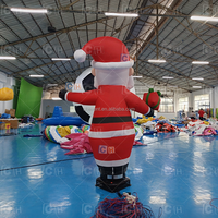 Père Noël Gonflable Dansant dans le Ciel avec Cadeau, Décoration Extérieure de Noël, Homme Agitant les Bras pour Promotion Commerciale des Fêtes