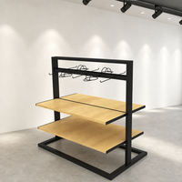 Table de présentation en bois à deux niveaux en métal noir avec crochets pour chapeaux, présentoir d'accessoires de vente au détail, vente en gros