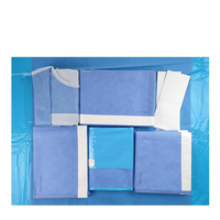 Pack chirurgical universel non tissé avec blouse chirurgicale renforcée et drap de table adhésif certifié CE