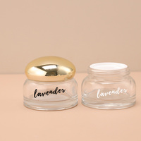 Pot en verre unique de 50g de pot de crème de gommage pour le visage couvercle galvanisé doré logo personnalisé pommade remplie de 50ml pots en verre pour le soin de la peau des yeux