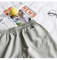 Short de course sportif en maille double personnalisé Short d'entraînement de gymnastique à séchage rapide Poches décontracté Short de plage mi-solide Longueur au genou