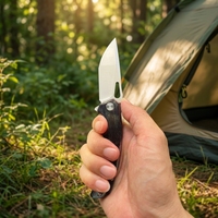 Couteau tactique personnalisé OEM en gros avec cadre en titane, lame VG10, motif éclair fait main, roulement à billes en céramique