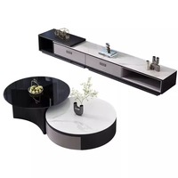 Ensemble de tables basses gigognes, surface en pierre frittée contrastée noir et blanc, design gain de place, tables rondes pour salon