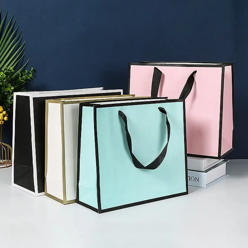 Sac à provisions emballage imprimé cadeau sac à provisions en papier pour vêtements marque de luxe logo personnalisé boutique de chaussures sacs d'emballage rose