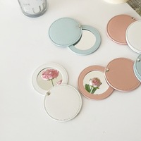 Miroir de maquillage compact rond en cuir PU rotatif avec logo personnalisé, idéal pour les cadeaux, vente en gros