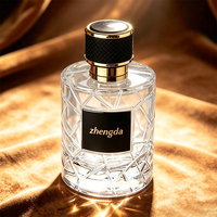 Flacon de parfum vide rechargeable en verre de 100 ml, forme ronde, avec pulvérisateur à pompe, qualité supérieure, personnalisable avec logo de marque et coffret cadeau, directement de l'usine