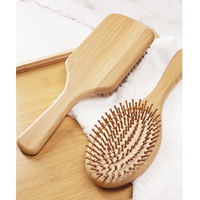 Brosse à cheveux démêlante en bois de bambou avec logo personnalisé, fabricant de brosses à coussin d'air en bambou pour femmes
