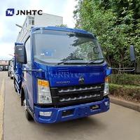 Haute qualité HOWO camion à ordures 4X2 5CBM 10CBM crochet bras camion à ordures compresseur de déchets pour la Papouasie-Nouvelle-Guinée