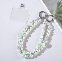 Dragonne de luxe portable et durable en alliage de zinc et plastique, ornée de perles de cristal, avec double chaîne, pour téléphone portable, porte-clés, étui de sac et dragonne de poignet