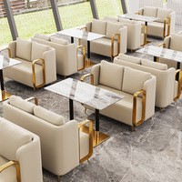 Canapé de restaurant populaire, ensemble table et canapé de café moderne en cuir rembourré et acier inoxydable