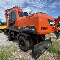 Excavatrice sur pneus d'occasion Doosan DX210, 21 tonnes, mobile, autopropulsée pour travaux d'ingénierie urbaine et de construction de pipelines