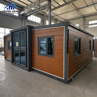Maison Modulaire Conteneurisée de Luxe Moderne avec Panneaux Muraux Effet Bois et Entrée en Verre pour Villa, Jardin, Maison d'Hôtes, Maison Conteneur