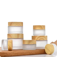 Bentuk datar 30ml 50ml 60ml 100ml topi lukisan kayu kosmetik stoples krim kaca wajah untuk penyemprotan penyimpanan dan tampilan rias