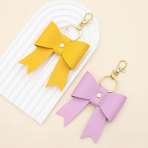 Porte-clés élégant en cuir PU avec nœud, breloques de luxe pour sac à main pour femmes, mousquetons promotionnels, ornements mignons en forme de nœud pour voiture, support de suspension - Product Image 1