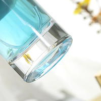 Bouchon de rouleau de bouteille de parfum en verre nouveauté de luxe personnalisé 50ml 100ml emballage épais transparent couvercle de cylindre forme carrée boîte en liège