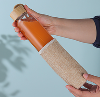 Gobelet à eau en verre isolé résistant à la chaleur moderne de 500 ml, très vendu, réutilisable, avec couvercle en bambou à visser, housse en lin, anti-fuite