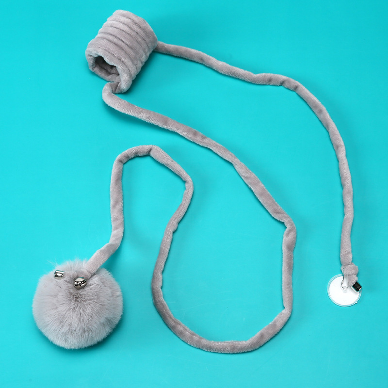 Gray extended door spring fuzz ball