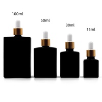Flacon d'huiles essentielles de haute qualité pour sérum/gouttes pour les yeux, 15 ml, 30 ml, 50 ml, 100 ml, flacon carré en verre givré noir avec compte-gouttes