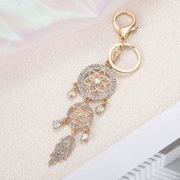 Porte-clés attrape-rêves en strass de cristal tendance, avec plume en métal doré, breloque pour sac, cadeau d'anniversaire pour femme, support de clés