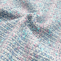La tela de tweed de moda más vendida es adecuada para la decoración del lugar de alojamiento del programa y se enviará inmediatamente