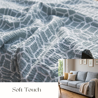 Tissu en crêpe de coton texturé à effet froissé, motif folklorique scandinave, design nid d'abeille