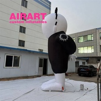 Prop publicitaire gonflable géant personnalisé pour extérieur, personnage de dessin animé gonflable blanc sur pied avec des pointes sur la tête