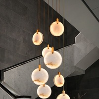 Lustre d'escalier en colimaçon moderne et simple tout en cuivre Nouveau design en marbre espagnol Chinoiserie pour maison duplex Moyen pour creux