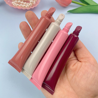 Nouvel arrivage de tube de brillant à lèvres vide rose nude marron mat baume à huile emballage de tubes de brillant à lèvres doux de marque privée