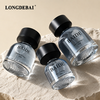 Flacon de parfum transparent de qualité supérieure, haut de gamme, 30 ml, 50 ml, 100 ml, flacon de parfum rond en verre vide avec couvercle noir