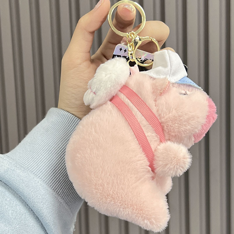 Mochila de béisbol con diseño de carpincho rosa.