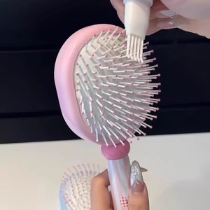 Brosse à coussin d'air crémeuse et mignonne à dents larges en nylon pour usage domestique - Product Image 1