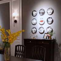 Assiette en céramique pour décoration murale de salon, motif visage humain, idéale pour la maison et comme présentoir à bijoux de bureau, disponible en import.