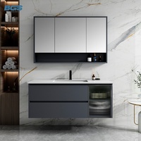 Meuble-lavabo mural moderne avec armoire en ardoise, miroir LED, vasque en céramique et évacuation en cuivre pour hôtel ou appartement