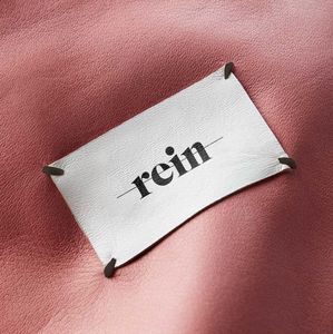 Factory wholesale prices on inexpensive woven neck tags sewn onto customizable fabric with your own logo. Fast shipping - Product Image 3