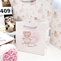 Sacs cadeaux en papier recyclable rose avec poignée en corde pour l'emballage des bougies