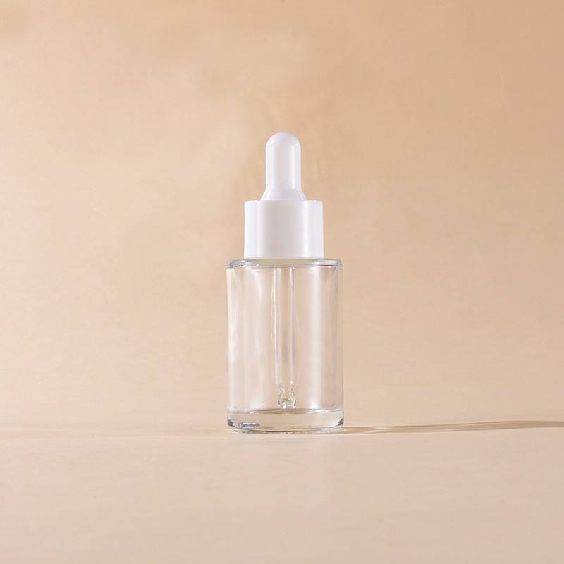 transparent bottle with white dropper cap