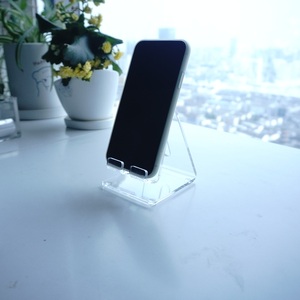 Wholesale Premium Waterproof Acrylic Cell Phone Display Stand with Customized Logo - Product Image 1