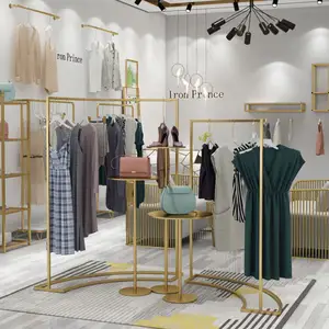 Soporte de exhibición colgante para tienda de ropa, mesa de exhibición de ropa de diseño Interior de Boutique, de acero inoxidable dorado