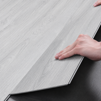 Plancher en vinyle PVC caoutchouté de luxe étanche LVT/SPC/WPC avec design graphique, carrelage plastique européen adhésif pour intérieur