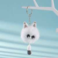 Porte-clés tendance le plus vendu, avec pompon en métal argenté, structure duveteuse, garniture oreille de pêche, breloque œil d'étoile et queue de chat