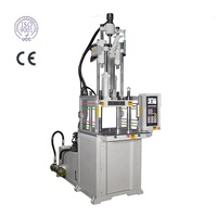 Machine de moulage vertical hydraulique de bonne qualité pour l'usine de fabrication de prises électriques, moteur, matériaux PET/ABS/PC/PP/PA