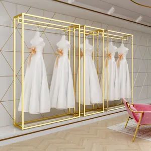 Magasin de vêtements personnalisés Présentoir de luxe en acier inoxydable pour magasin de meubles pour robes de mariée en or Vêtements pour boutique