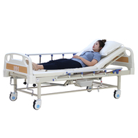 Lit médical manuel avec toilettes intégrées pour soins hospitaliers et à domicile des patients paralysés