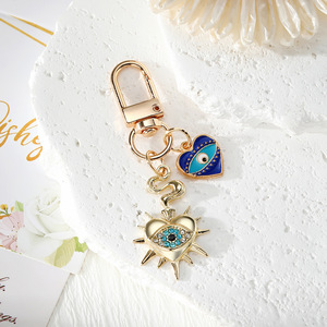 Nouveau design Porte-clés Œil de protection en métal doré avec pendentifs Cœur, Étoile, Hexagone, Amulette porte-bonheur - Product Image 5