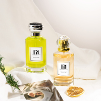 Botella de perfume cilíndrica acanalada de lujo de 30ml, 50ml y 100ml, diseño de vidrio transparente con tapa y embalaje personalizables