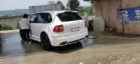 Kit carrosserie style MSY modifié pour Porsche Cayenne 957, comprenant pare-chocs avant et arrière, capot et kit carrosserie large avec extensions d'ailes et passages de roues.