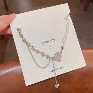 High-quality light luxury niche senior design sense stitching pearl titanium steel pink crystal love necklace