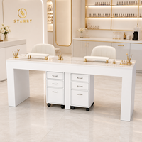 Table de manucure double pour salon de beauté avec armoires à tiroirs mobiles et deux postes de travail pour techniciennes