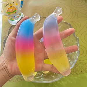 NovaCross Nouveau Jouet Anti-Stress Coloré Scintillant en Maltose et Banane, Doux et Moelleux, Balle à Presser en TPR pour Soulager le Stress - Product Image 1