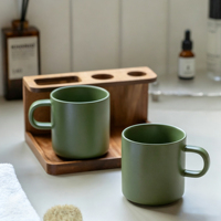 Vente en gros de tasses à café en céramique de couleur unie simple, tasse en céramique verte mate avec logo personnalisé